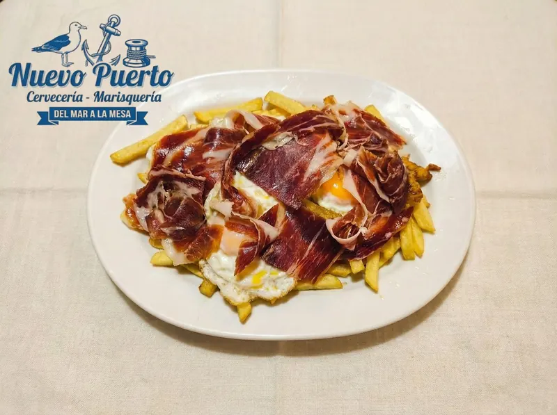 Huevos rotos con jamón
